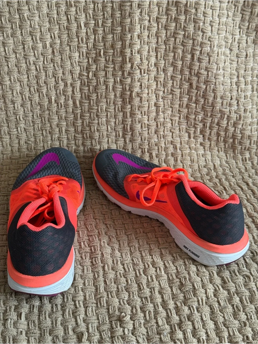 Nike Women's Neon Orange Running Sneakers with Purple Swoosh